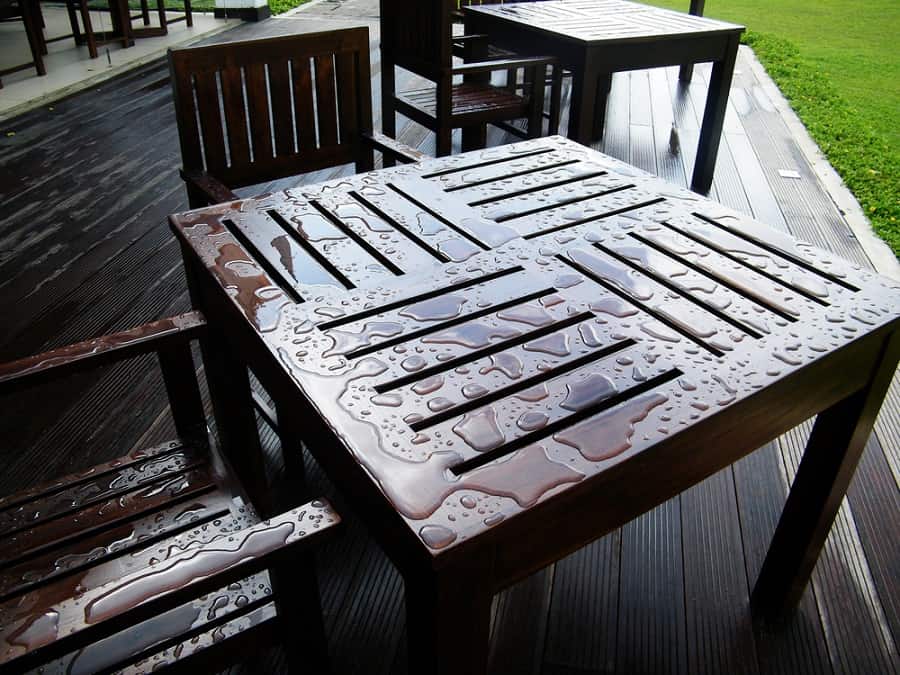 Wet wood furniture in backyard
